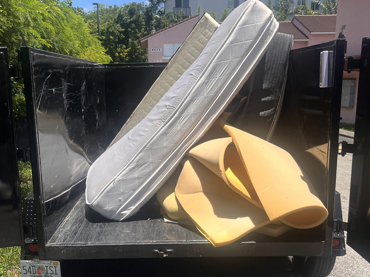 Mattress in the dump trailer bed for junk removal